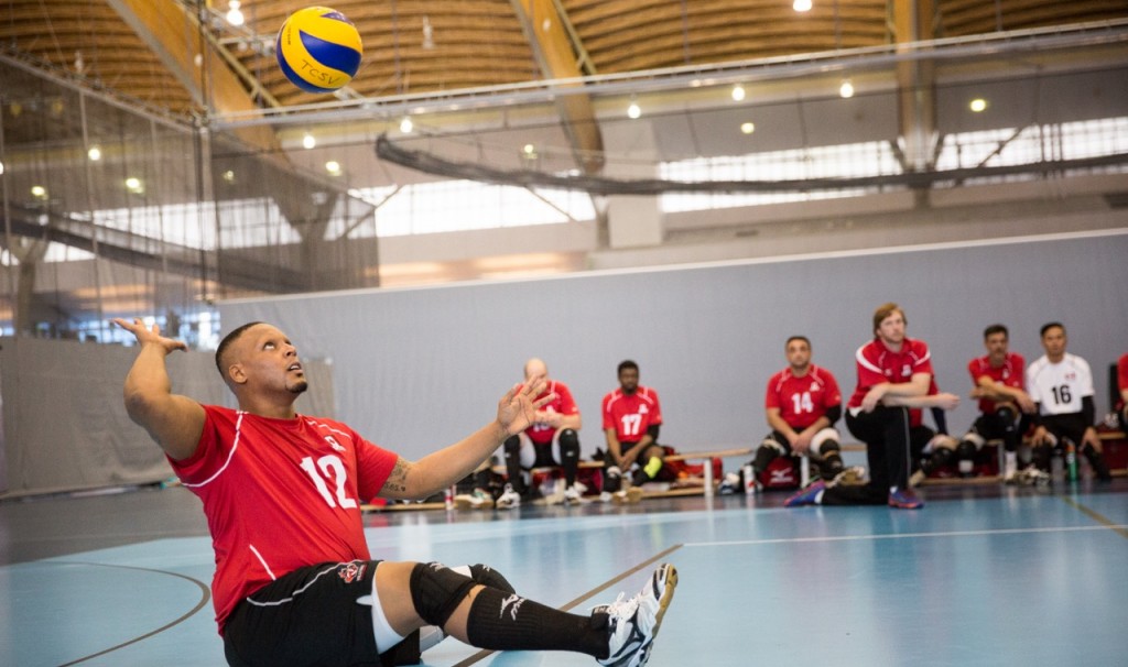 Jamoi Anderson winds up for a serve during a sitting volleyball match. Photo courtesy: Volleyball Canada