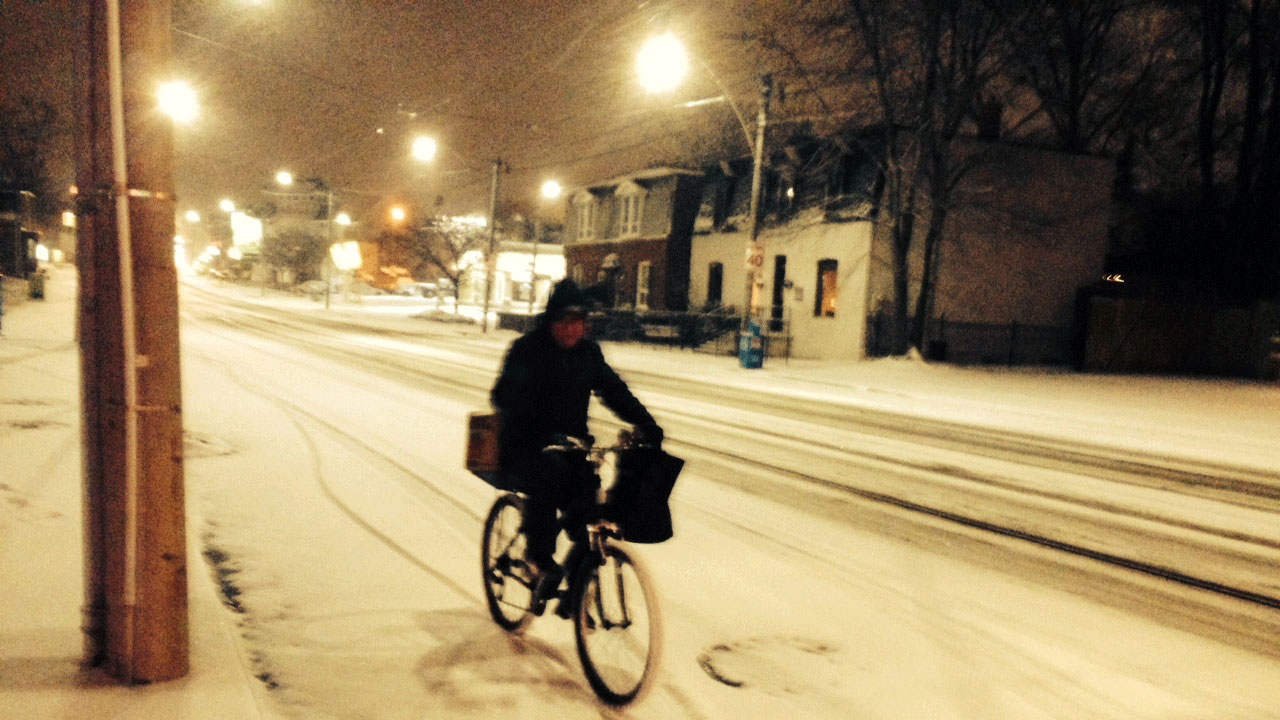 A commuter riding his bicycle in the snow in Toronto on Jan. 12, 2016. CITYNEWS/Bertram Dandy.
